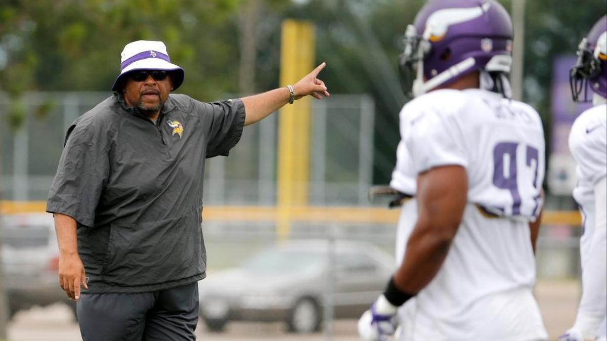 Minnesota Vikings defensive line coach and former Cal Poly head coach Andre Patterson instructs his players during practice at an NFL football training camp on the campus of Minnesota State University on July 28, 2015.