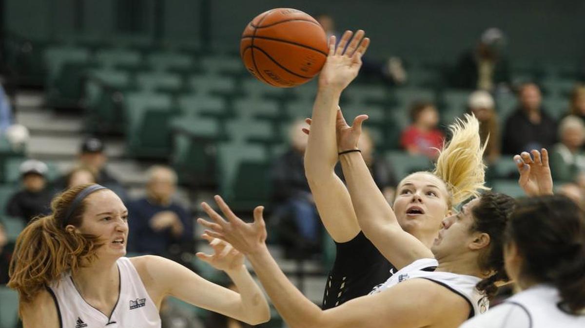 Hannah Gilbert goes for a rebound. Cal Poly hosted UC Davis in a Big West Conference women’s basketball game Thursday night at Mott Athletics Center.
