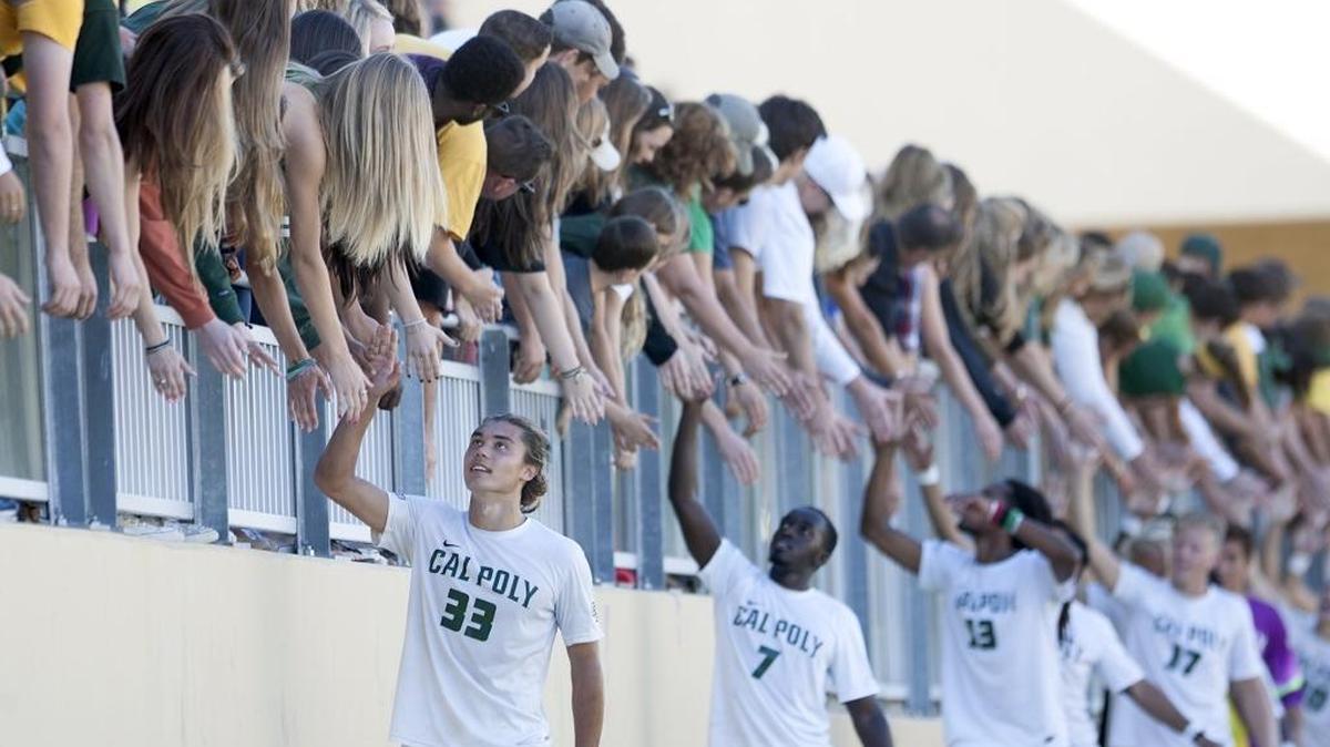 Cal Poly soccer team players, Kody Wakasa (33), Ismail Seremba (7), Kaba Alkebulan (13) and Bjorn Sandberg (17) walk along the fans in the stands after winning a Big West Conference tournament game against UC Irvine on Nov. 7.