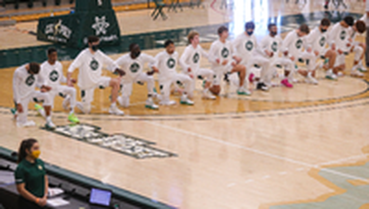 The team as a unit took a knee in solidarity during the National Anthem a few days after a deadly insurrection at the U.S. Capitol. Cal Poly hosted UC Riverside for an NCAA men’s basketball game.