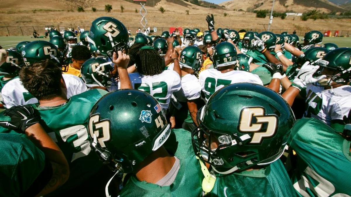 Cal Poly football players gather together before the start of a recent practice at the upper fields of the Cal Poly Sports Complex. The Mustangs begin their season Sept. 2 at Nevada.