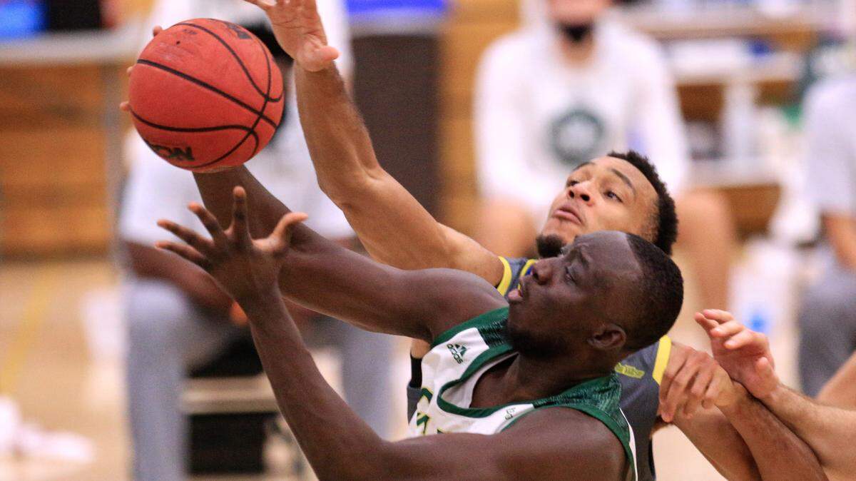 Cal Poly’s Alimamy Koroma shoots as U.C. Riverside’s Arinze Chidom contests the shot. during their basketball game in San Luis Obispo, Calif., Friday, Jan 15, 2021. The Mustangs lost 68-66 to UC Davis in their final home game this season.