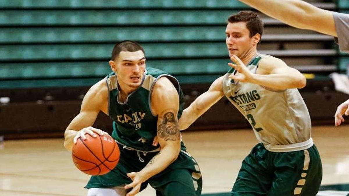 Cal Poly’s Josh Martin, left, will miss the remainder of his junior season after suffering a stress fracture in his foot.