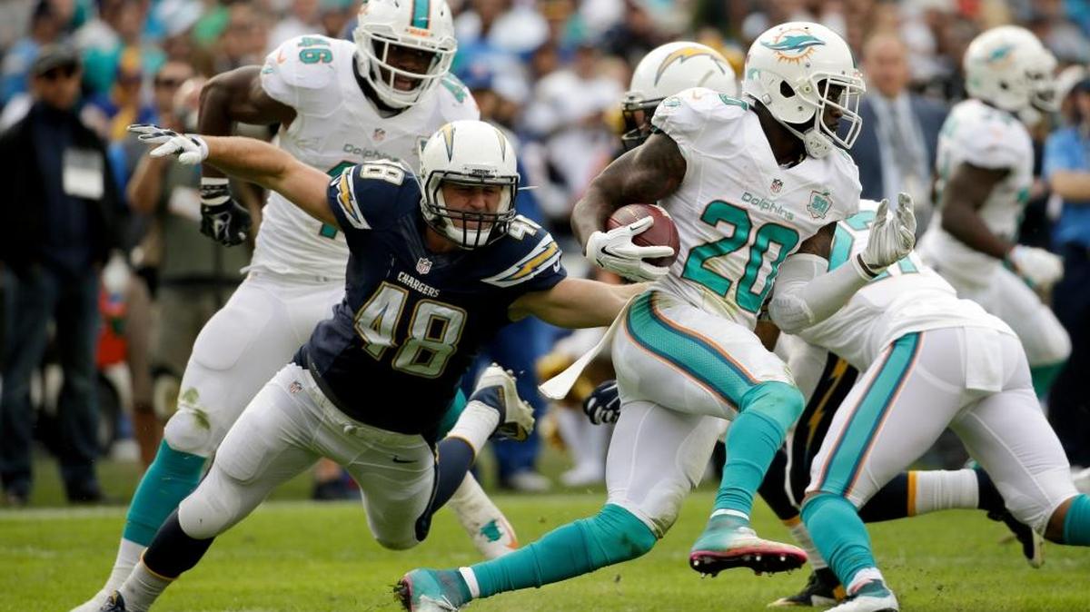 San Diego Chargers linebacker Nick Dzubnar (48) pursues Miami Dolphins strong safety Reshad Jones during a Dec. 20 game in San Diego at Qualcomm Stadium.
