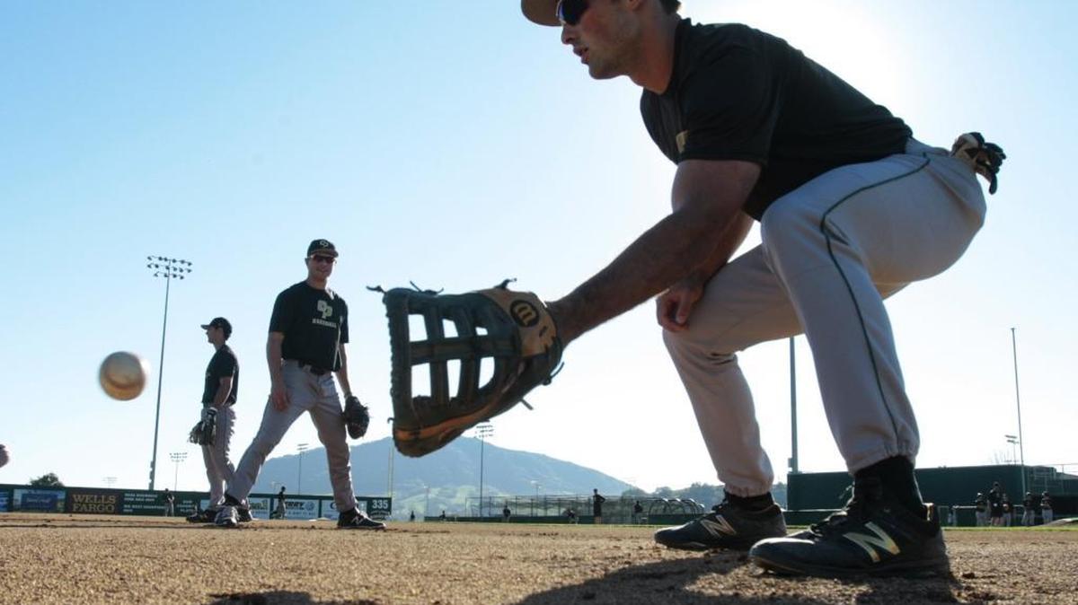 Cal Poly’s Brett Barbier fields a ball in the dirt during practice last week at Baggett Stadium. The Mustangs begin their 2016 season Friday night against Pacific.