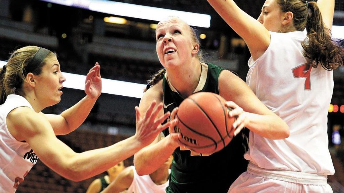 Former Cal Poly standout Molly Schlemer, center, is averaging more than 21 points and 13 rebounds per game playing professionally overseas in the Turkish Women’s Basketball League.