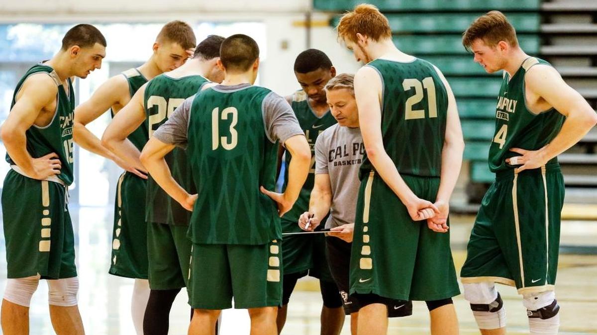 Cal Poly men’s basketball coach Joe Callero works with his team during practice at the Mott Athletics Center. The Mustangs open Big West Conference play at 5 p.m. Saturday at UC Davis.