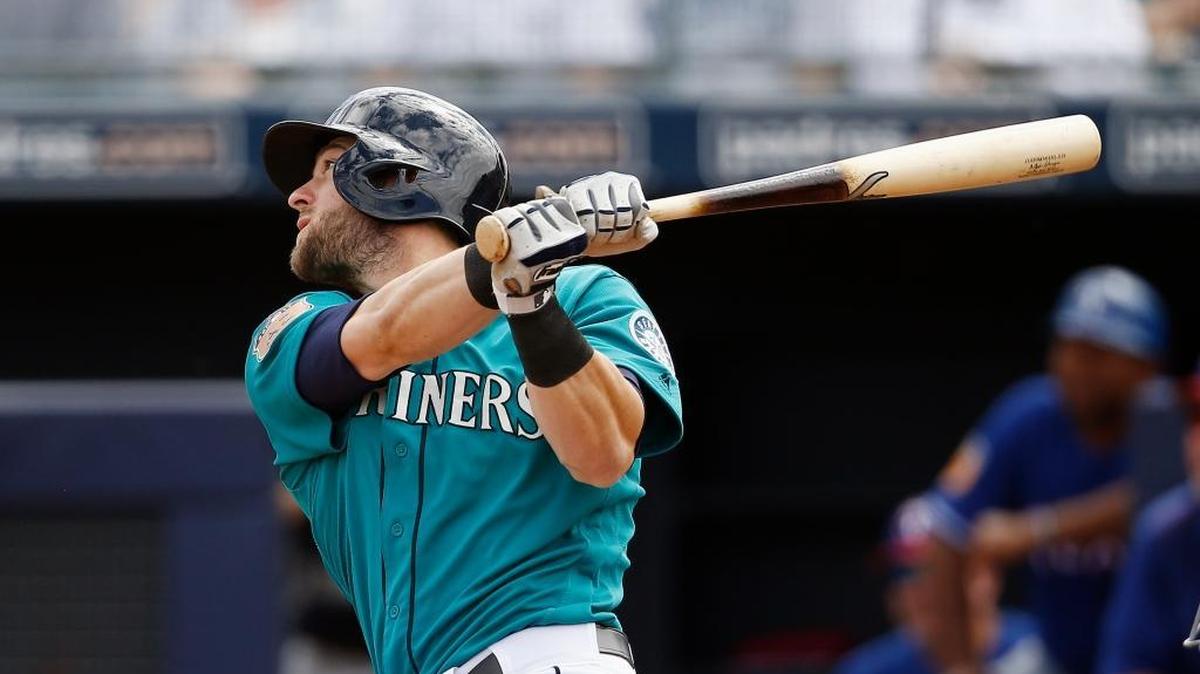 Former Cal Poly star and current Seattle Mariner Mitch Haniger watches the flight of his double against the Texas Rangers during the first inning of a spring training baseball game Saturday, March 25, 2017, in Peoria, Ariz.
