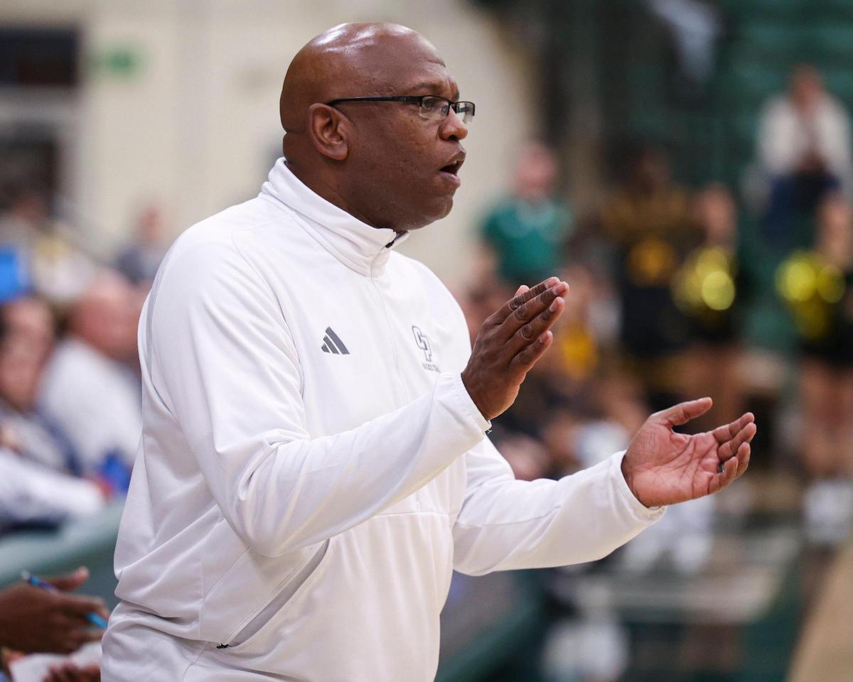 Cal Poly head coach John Smith claps during a defensive sequence. Long Beach state won 89-82 at Cal Poly’s Mott gym Jan. 4, 2024.