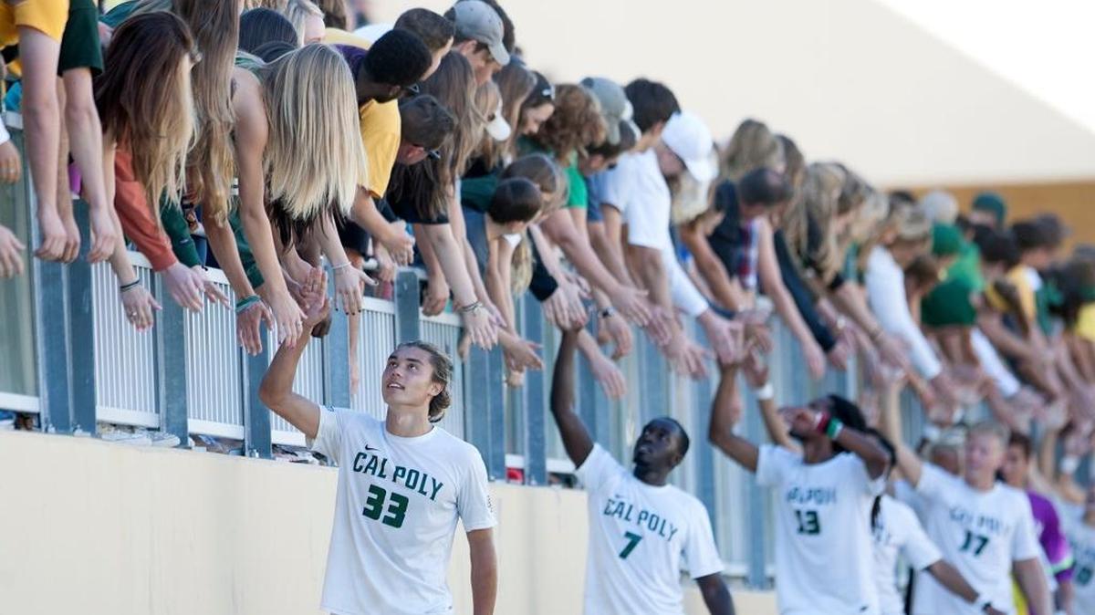 Cal Poly men’s soccer players Kody Wakasa (33), Ismail Seremba (7), Kaba Alkebulan (13) and Bjorn Sandberg (17) walk along the fans in the stands following its win against UC Irvine.