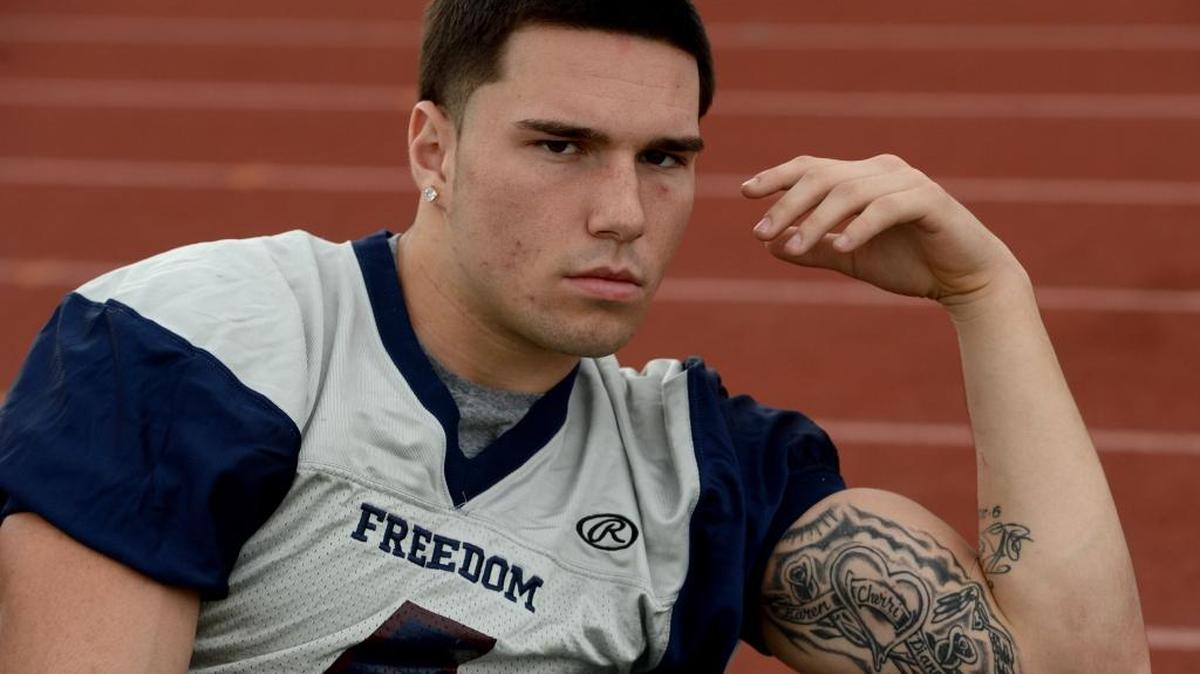 Freedom High School linebacker Kyle Harmon is photographed in October before practice in Oakley, Calif. Harmon has tattoos on his arm honoring his father Kevin with the date of his birth and death and another with his mother’s name and grandmother’s and godmother’s names. Harmon is verbally committed to play football at Cal Poly next season.