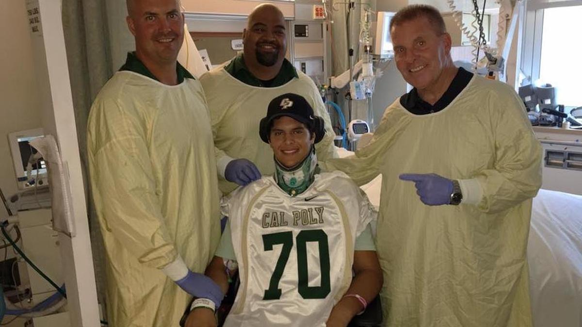 Cal Poly coaches Jim Craft, left, former offensive coordinator Saga Tuitel and head coach Tim Walsh visit San Ramon Valley High graduate and Cal Poly recruit Jake Javier in the hospital. Javier fractured his neck in a pool accident June 9.