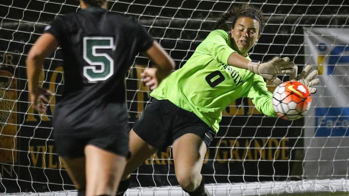 Cal Poly's Sophia Brown makes a save in the final three minutes of overtime. Chelsea Barry at left. Cal Poly women tied 1-1 in a soccer match with UCSB.