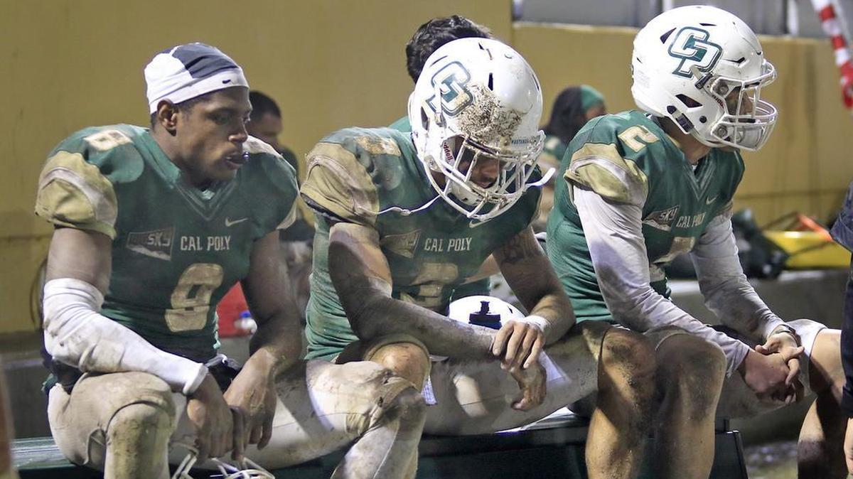 Cal Poly players react to the Mustangs’ season-ending loss to San Diego in the first round of the FCS playoffs Saturday night at Alex G. Spanos Stadium.