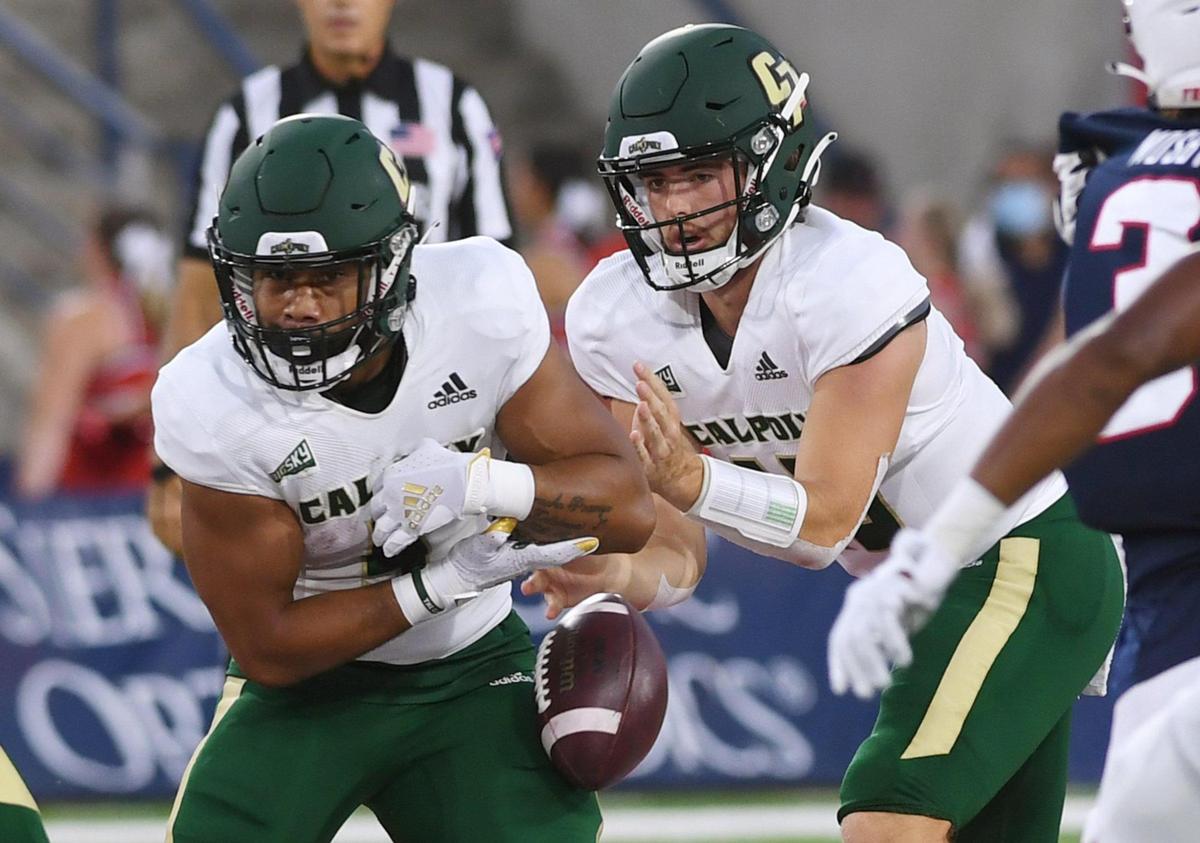 Cal Poly’s Lepi Lataimua, left, fumbles a handoff from quarterback Spencer Brasch, right, against the Fresno State Bulldogs Saturday, Sept. 11, 2021 in Fresno.