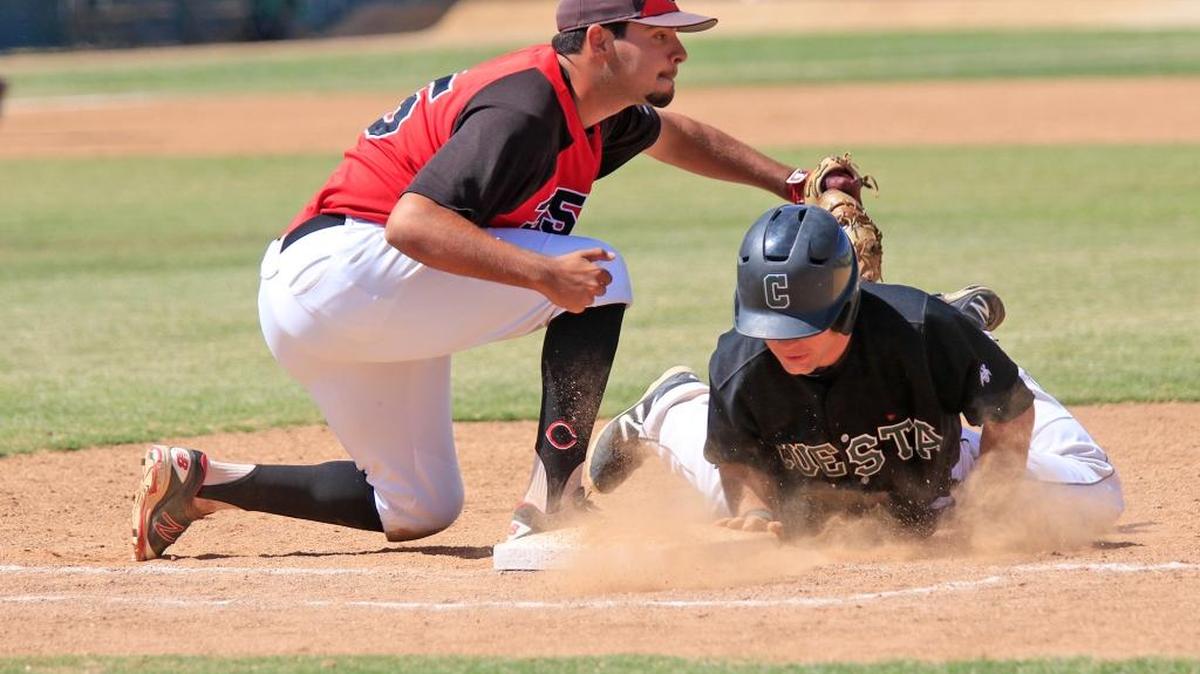 Chaffey College first baseman Aaron McCann (35) almost picks off Cuesta runner Todd Valliere (8) in the eighth inning. Chaffey went on to win the game 10-8.