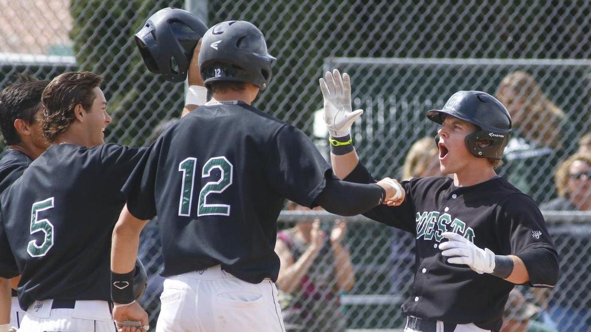 With a dramatic grand slam, the second in two games, Tanner Bos celebrates at home with Garrett Giovanelli (5) and Nick Burnham (12). Cuesta College defeated Palomar 7-4 in the first of a three-game series.