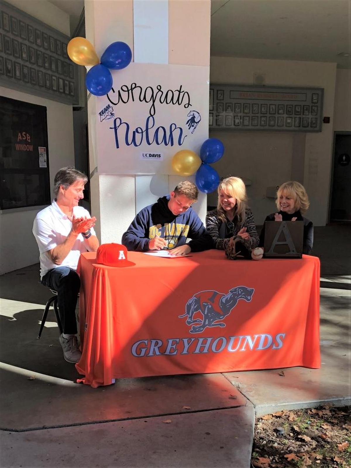 Atascadero senior Nolan Meredith signs with UC Davis to play baseball surrounded by his family.