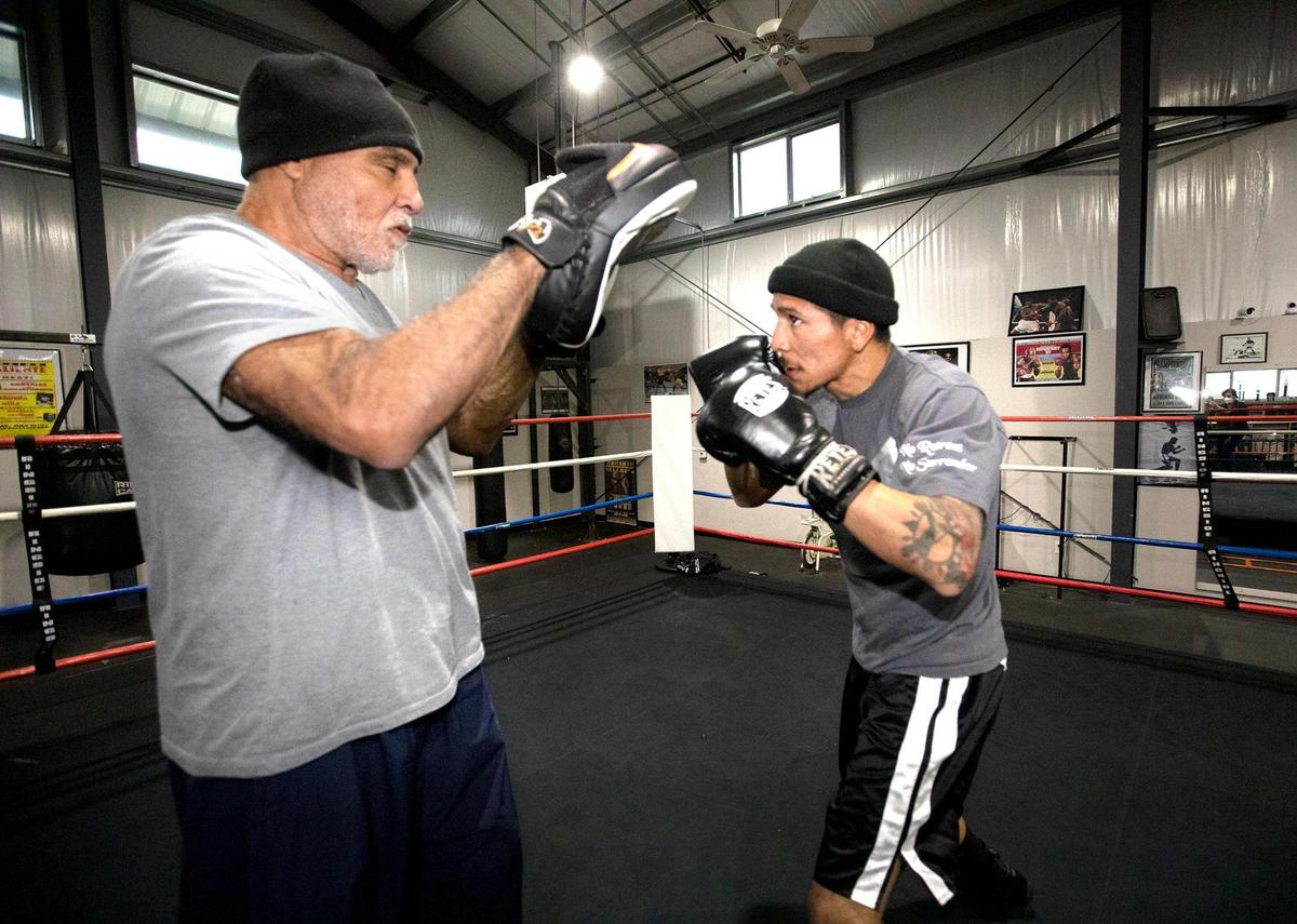Professional boxes Bryan Martinez, a 24-year-old Paso Robles resident, is getting ready to fight his first match Sacramento on Jan. 21, 2022. He spars with trainer, Michael Dixon, at Knockout Boxing Gym in Paso Robles, CA.