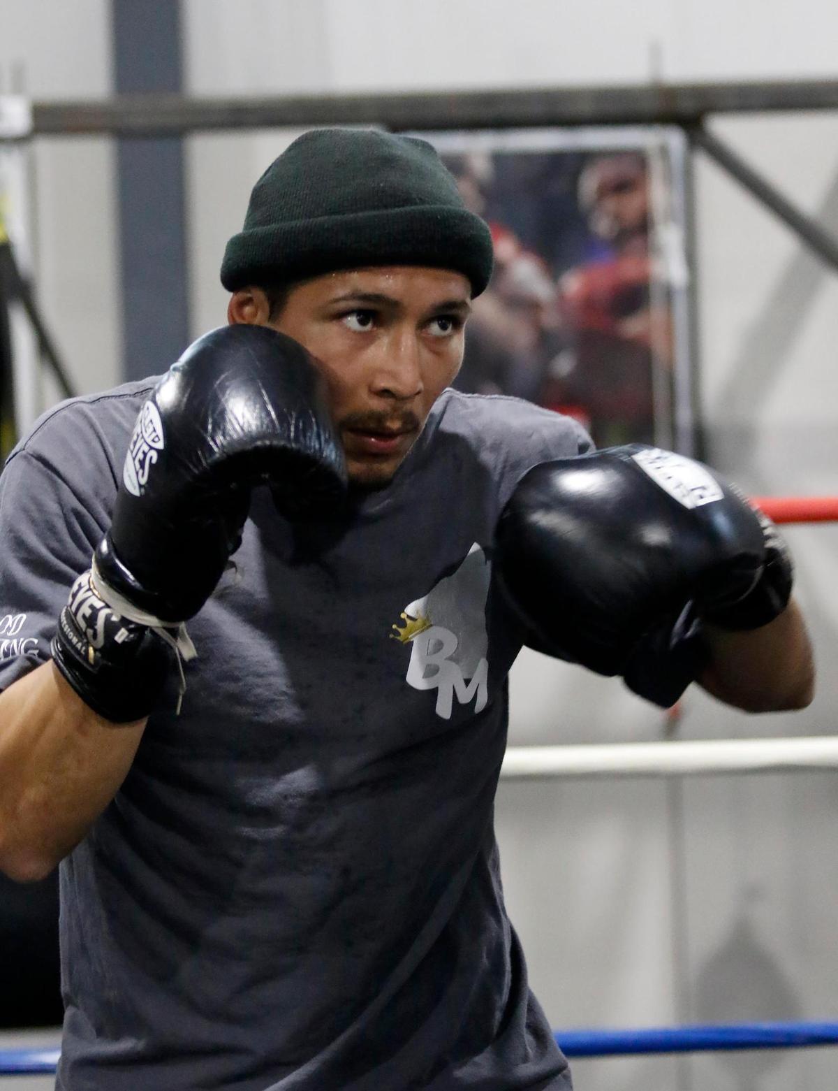Professional boxes Bryan Martinez, a Paso Robles resident, is getting ready to fight his first match Sacramento on Jan. 21, 2022. Martinez spars with his trainer (not pictured).