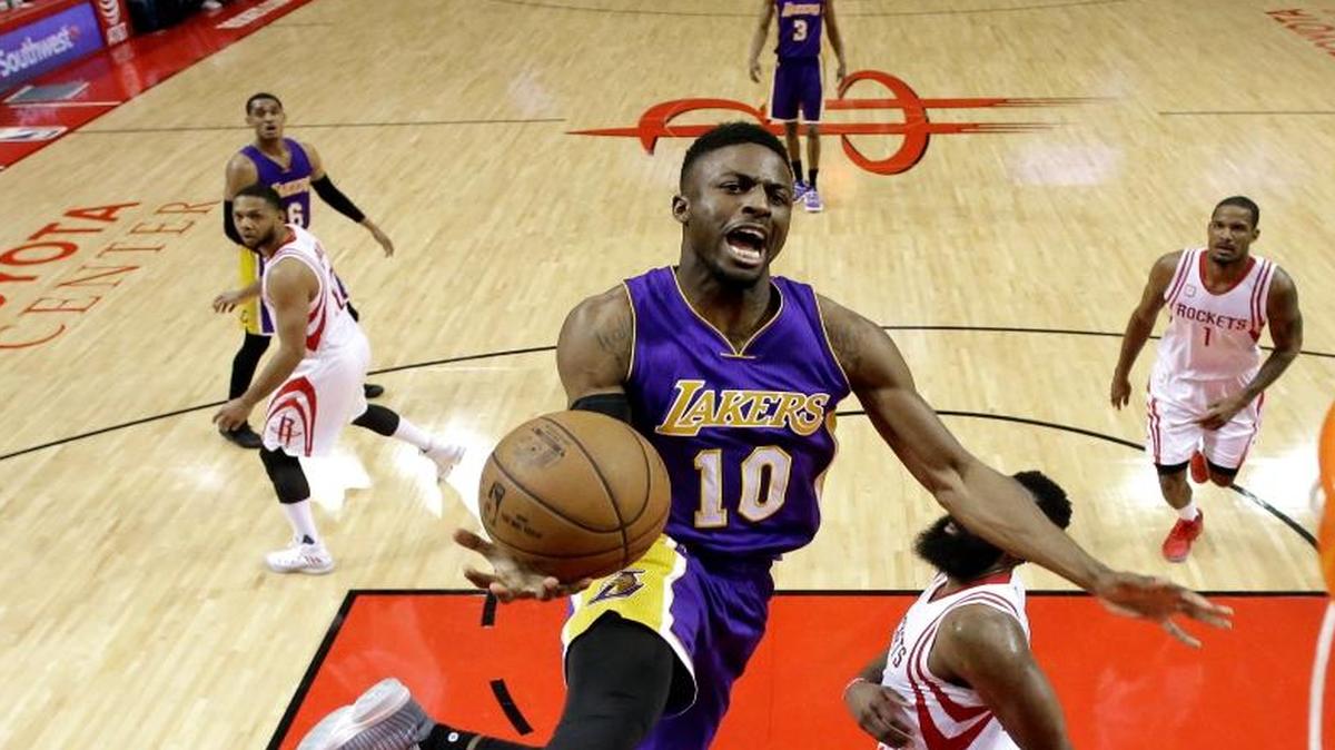 Los Angeles Lakers’ David Nwaba goes up for a shot as the Houston Rockets’ James Harden, right, defends during a game on March 15, 2017, in Houston.