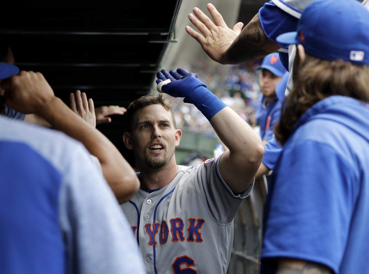 New York Mets’ Jeff McNeil celebrates with teammates after hitting a two-run home run against the Chicago Cubs during the third inning of a baseball game in Chicago, Friday, June 21, 2019.