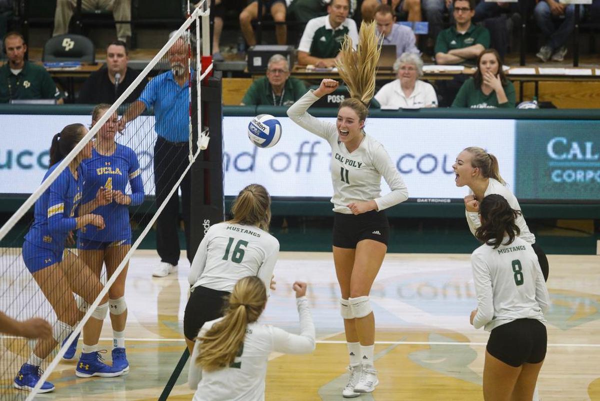 Torrey Van Winden (11) celebrates during the Cal Poly volleyball team’s 3-1 victory over UCLA in 2018 at Mott Athletics Center in San Luis Obispo.