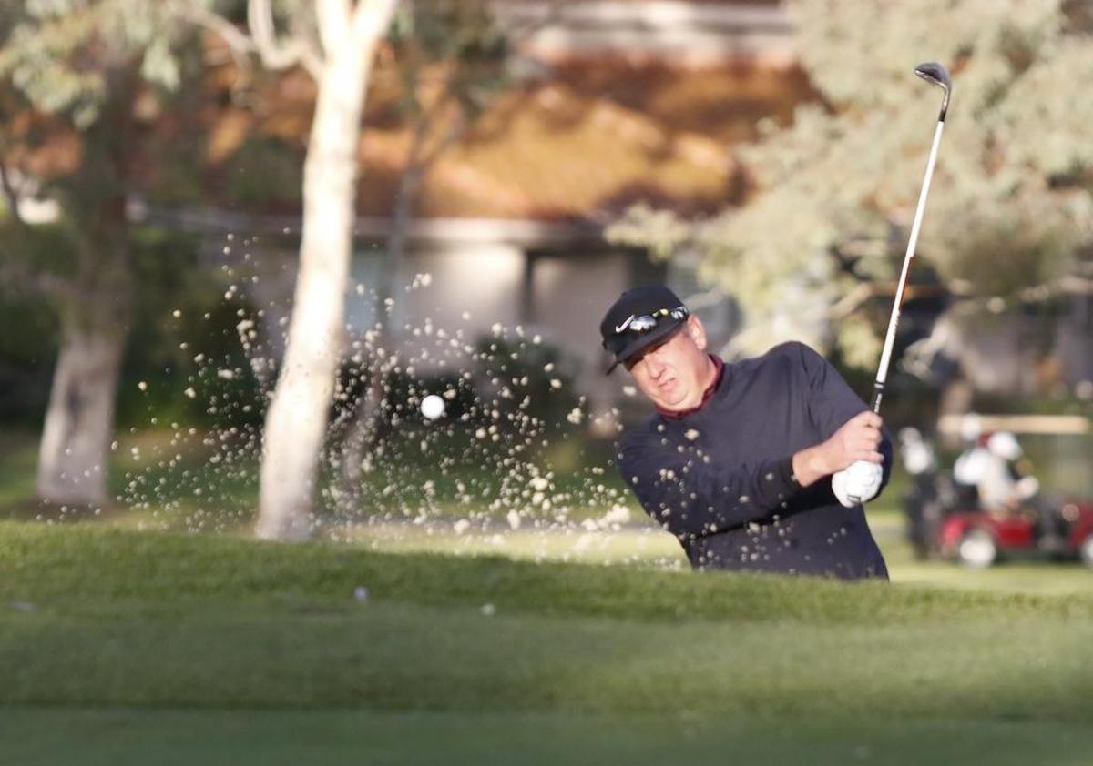 Scott Heyn chips onto the green at the 17th hole while competing in the 2018 Straight Down Fall Classic. Heyn of Oakmont and partner Corby Segal of Woodland Hills won the event last year.