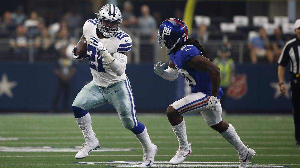 Dallas Cowboys running back Ezekiel Elliott (21) finds running room as New York Giants cornerback Janoris Jenkins (20) defends during a NFL football game in Arlington, Texas, Sunday, Sept. 8, 2019. (AP Photo/Ron Jenkins)