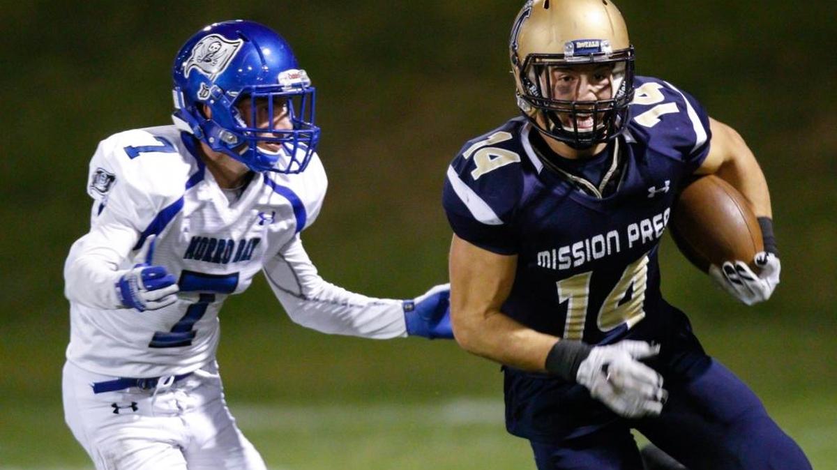 Patrick Miller runs after a catch while pursued by Josh Skiffington in the Royals win over Morro Bay on Nov. 16, 2015.