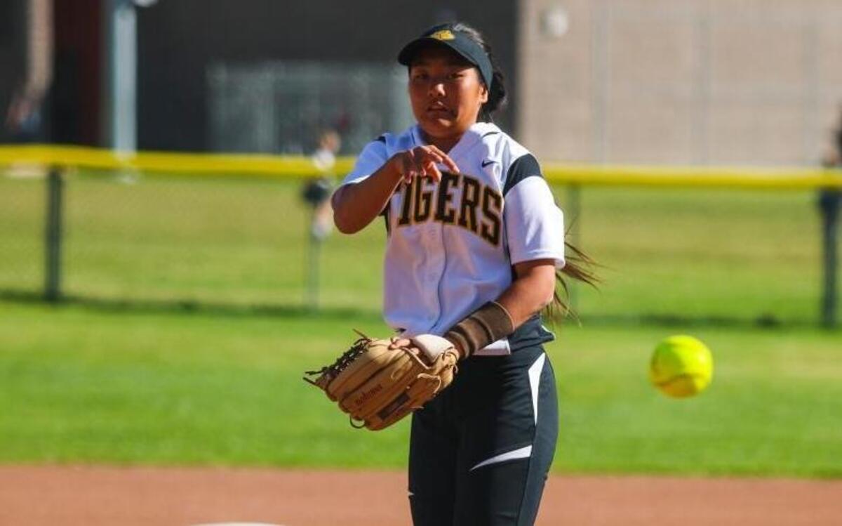 San Luis Obispo High freshman Xiao Gin delivers a pitch in a game against Righetti in 2017.