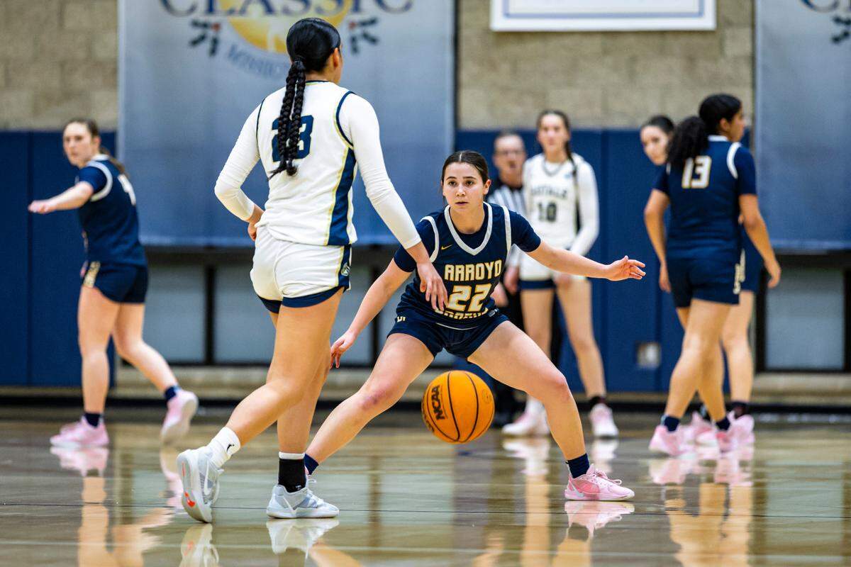 No. 22 Sophia Robertson for Arroyo Grande takes a defensive stance against K.K. Guy for Mission Prep. Mission Prep girl’s basketball team beat Arroyo Grande 55-51 on Feb. 11, 2025.