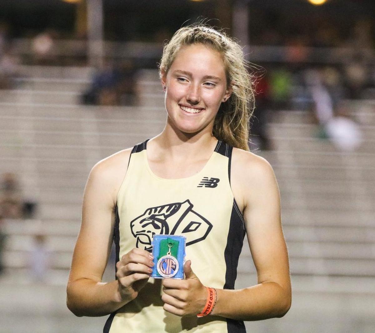 SLO High sophomore Anneke Moersdorf shows off her sixth-place medal following the CIF State Track Meet in Clovis in 2017.