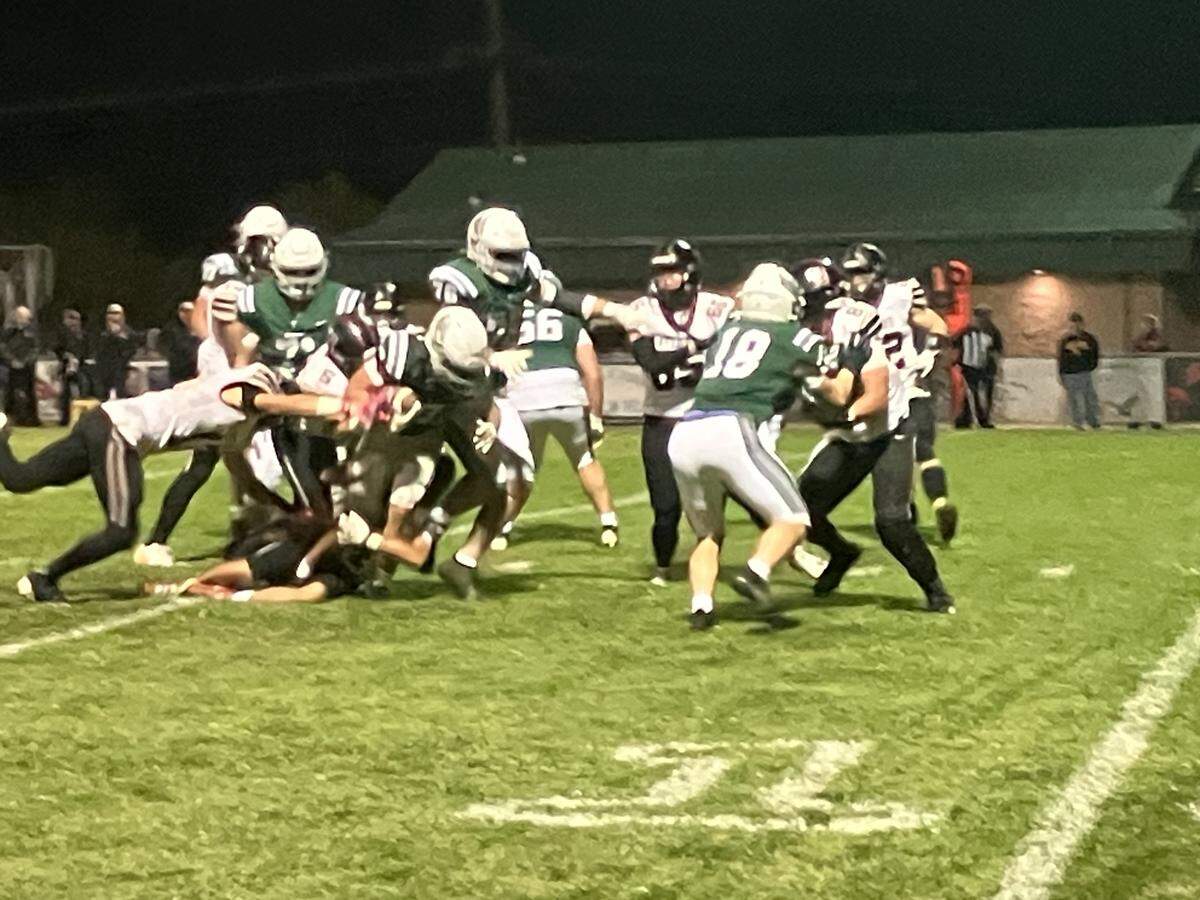 Tyler Cunningham powers through the Nipomo defensive line in a 56-31 win Friday.