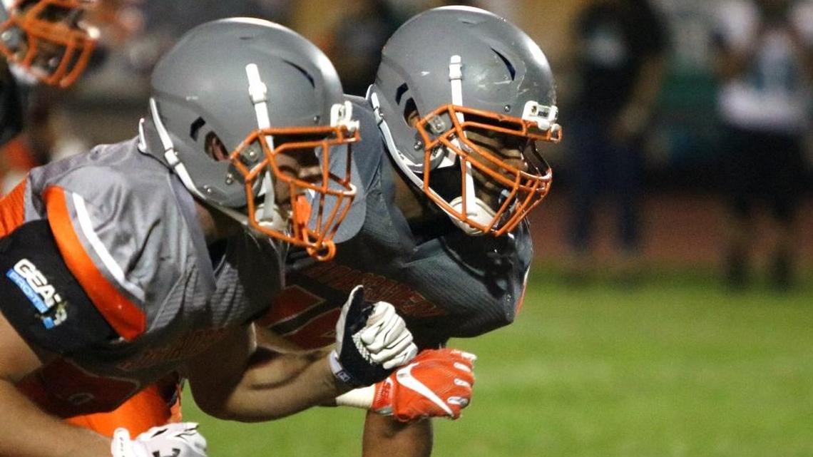 Atascadero senior defensive end Kamren Brown (right) had two sacks in a win over Pioneer Valley.