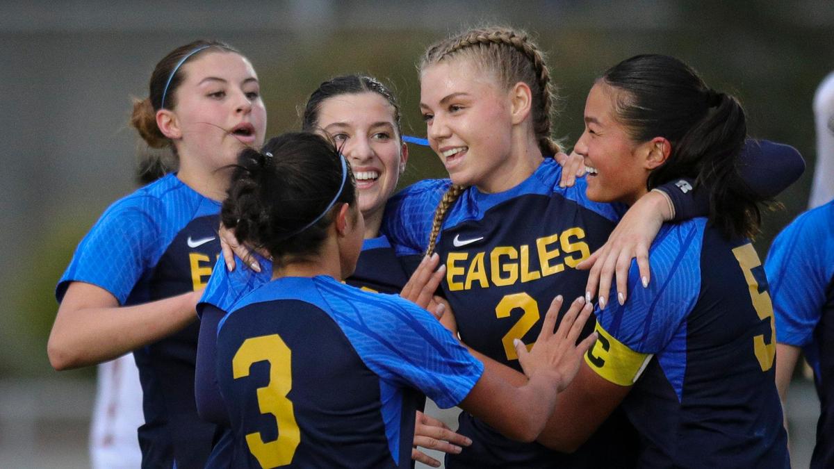 Presley Dunkle gets hugs from team after second goal was scored with less than eight minutes remaining in the first half. Arroyo Grande girls won 2-0 over Estancia on Feb. 29, 2024, to advance to the 2024 CIF SoCal Division IV Girls Soccer Championship.