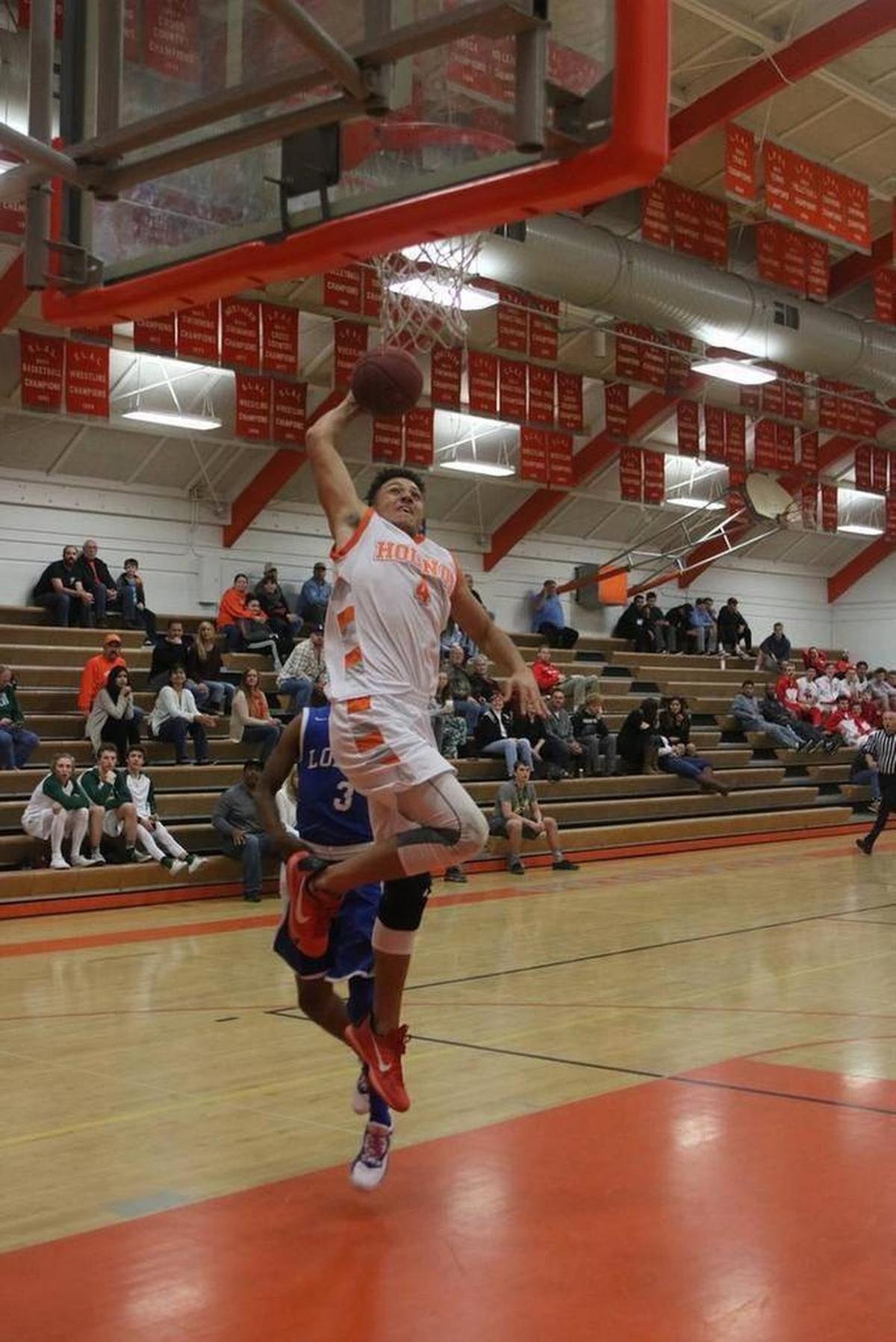 Atascadero senior Elijah Cooks goes up for the slam in a game against Lompoc in 2016.