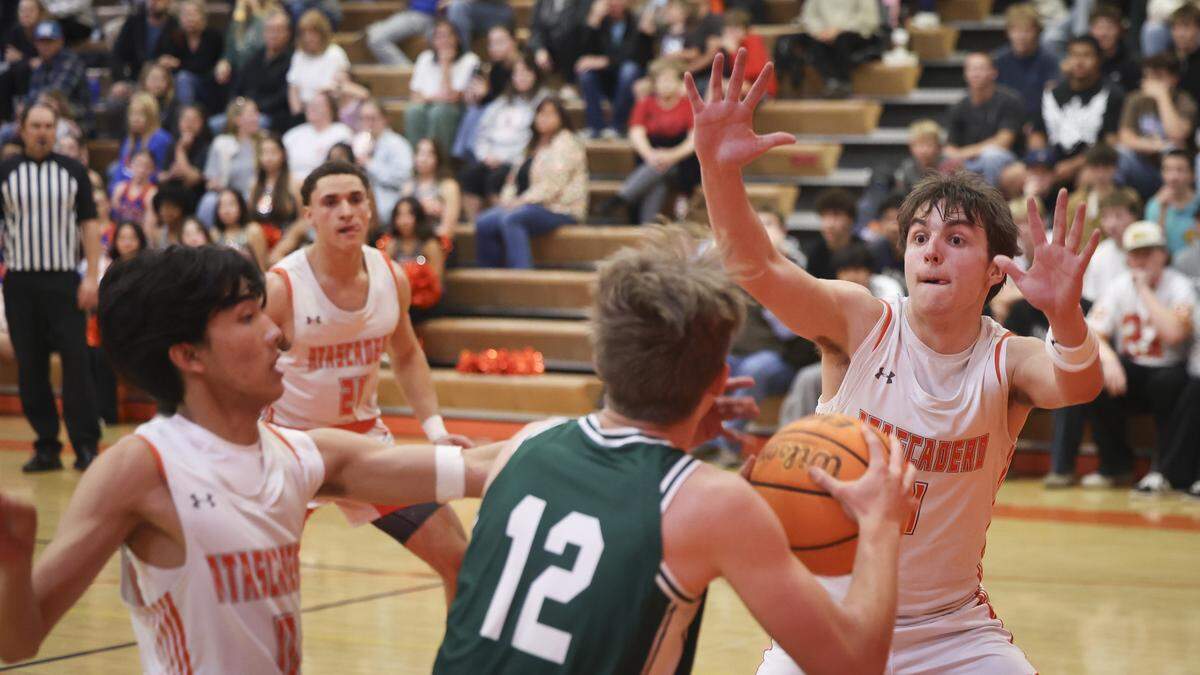 The Greyhounds used an agressive press and defense to limit the Eagle offense. Kevin Sass is defended by Damian Marano, left, and Kyle Foster. Atascadero beat Templeton High School 76-55 in a basketball game on Jan. 20, 2026.