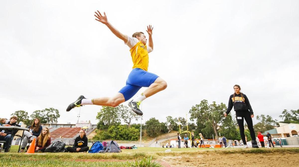 Arroyo Grande High’s Bradley Mickey competes in the triple jump at the PAC 8 track and field finals at Atascadero on Thursday. Photo by Joe Johnston 05-05-16