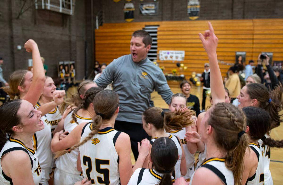 San Luis Obispo High School girls basketball team, led by Coach Dan Monroe (middle), has had its best season in at least three decades, going undefeated in the Sunset League and posting 25 regular season wins.