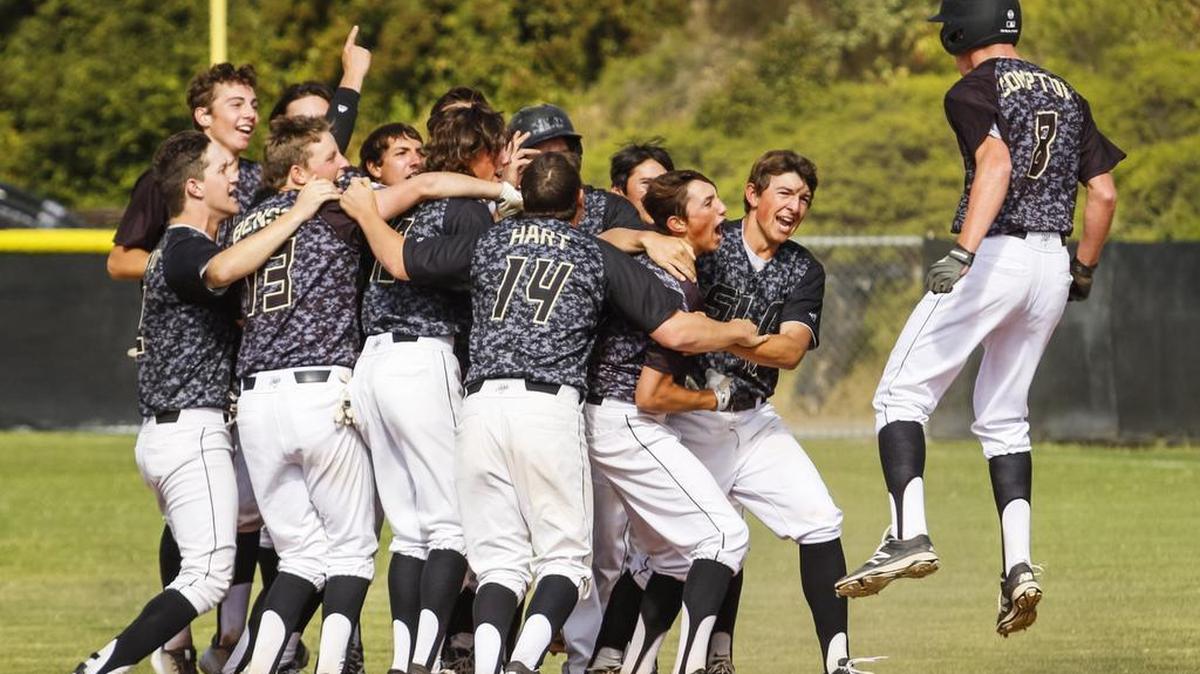 San Luis Obispo celebrates their walk off win with a hit from Brooks Lee against Segerstrom during Friday's playoff baseball game.