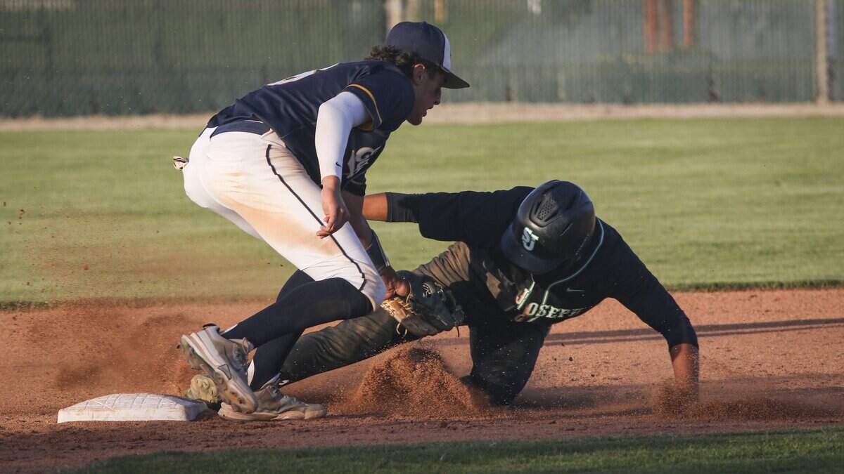 Ruben Servin tags out Eli Hendricks to end the innning on a stikeout-throw out at second base. St. Joseph beat Arroyo Grande High School 5-4 n a baseball game on April 17, 2026