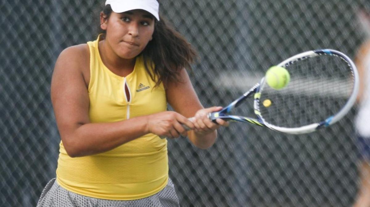 Maya Caminada hits a return shot for San Luis Obispo High School on Tuesday against Mission Prep.