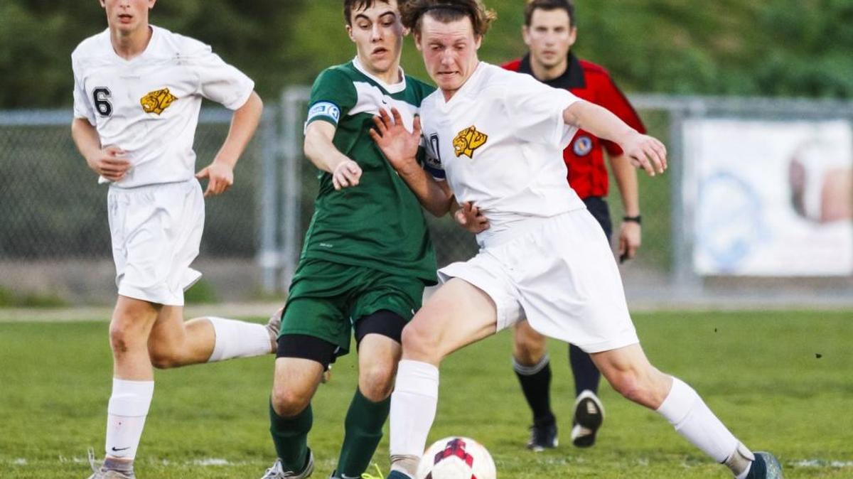 San Luis Obispo’s Brian Finger battles St. Joseph’s Kevin Cruden on Wednesday as the teams met during the final week of PAC 8 play.