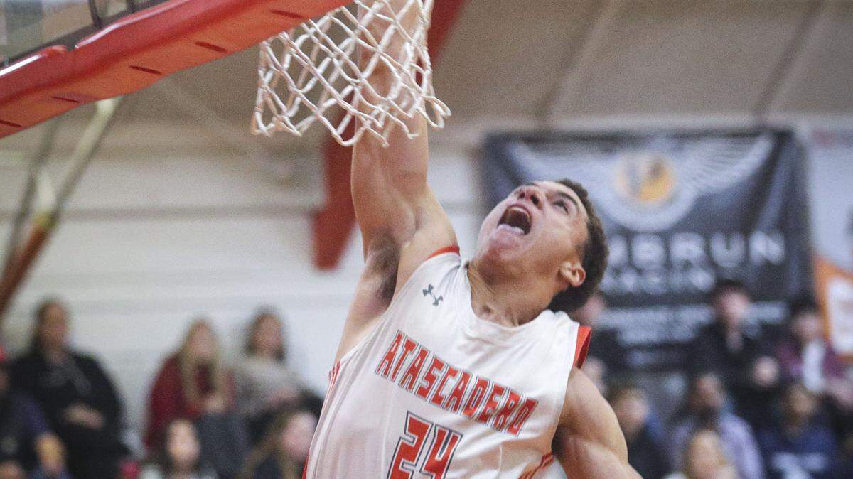 Damon Mitchell scores a breakaway basket. Atascadero beat Sanger 82-41 in a baskeball playoff Feb. 17, 2026.