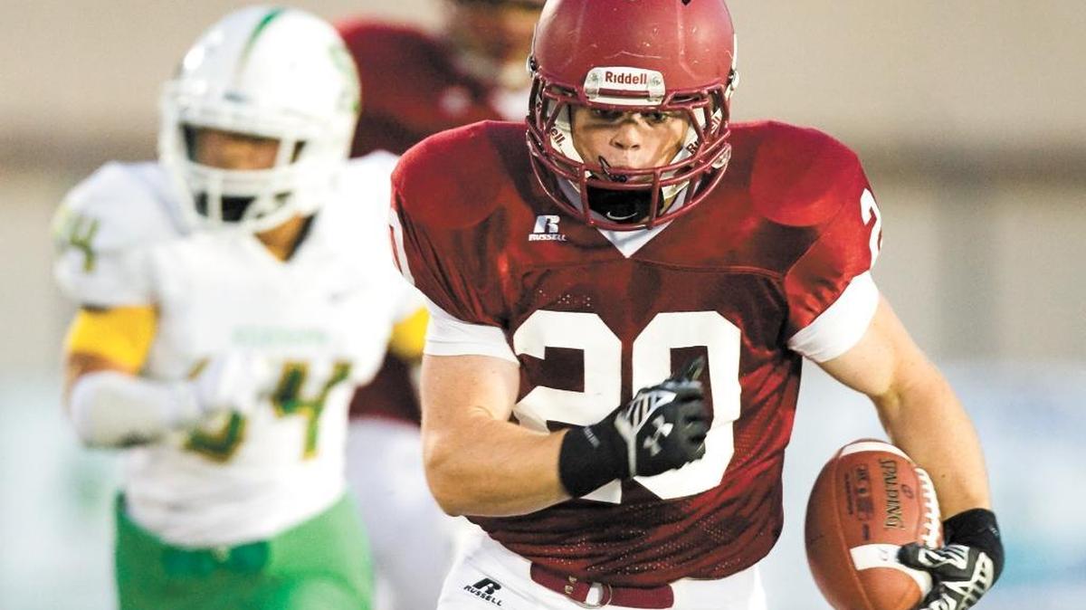 Paso Robles High running back Christian Erickson runs for a touchdown during the Bearcats’ first play against St. Joseph in a Sept. 19 game.
