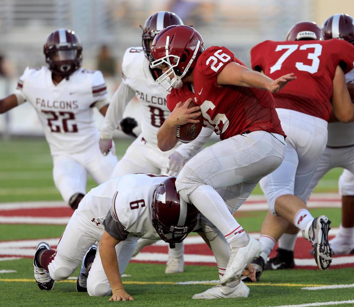 Running back Leo Kemp (26) pushes through the Falcon’s defense. Paso Robles High School Bearcats played Independence High School Falcons at War Memorial Stadium in Paso Robles Friday, August 27, 2021.