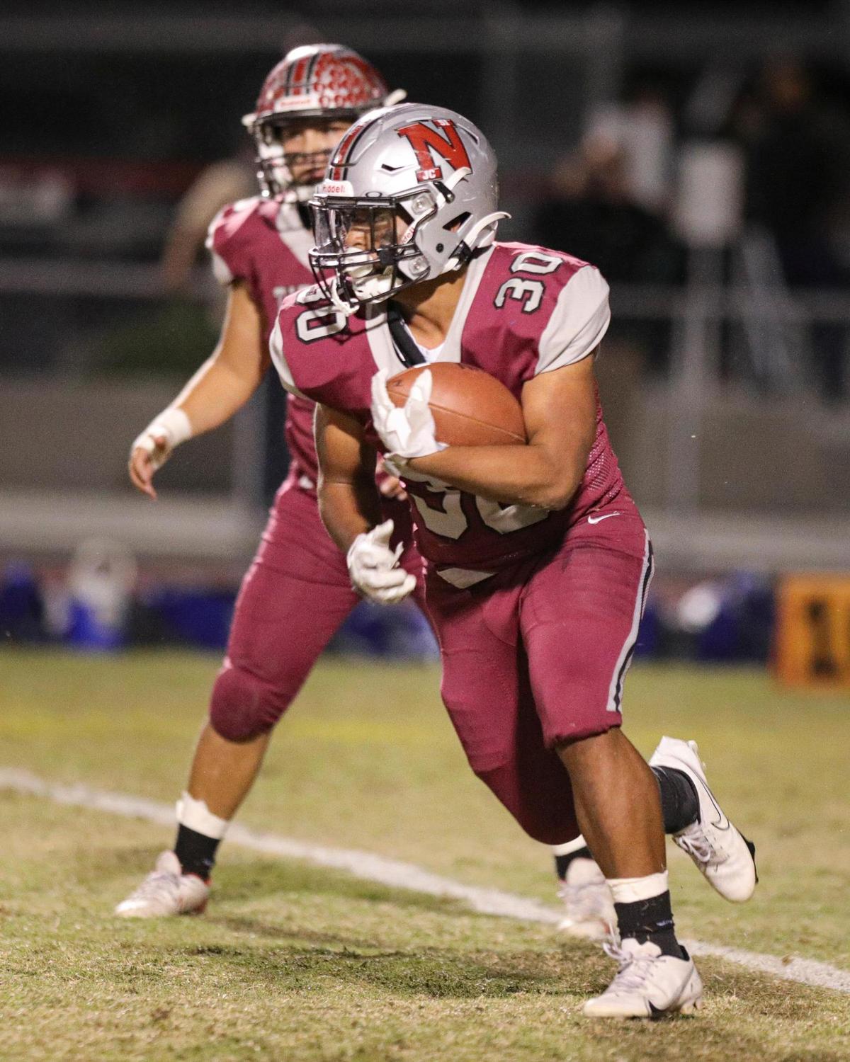 Gabriel Sanchez runs for the Titans. Nipomo fell to Highland 13-12 in the CIF-Central Section football playoffs on Nov. 12, 2021.