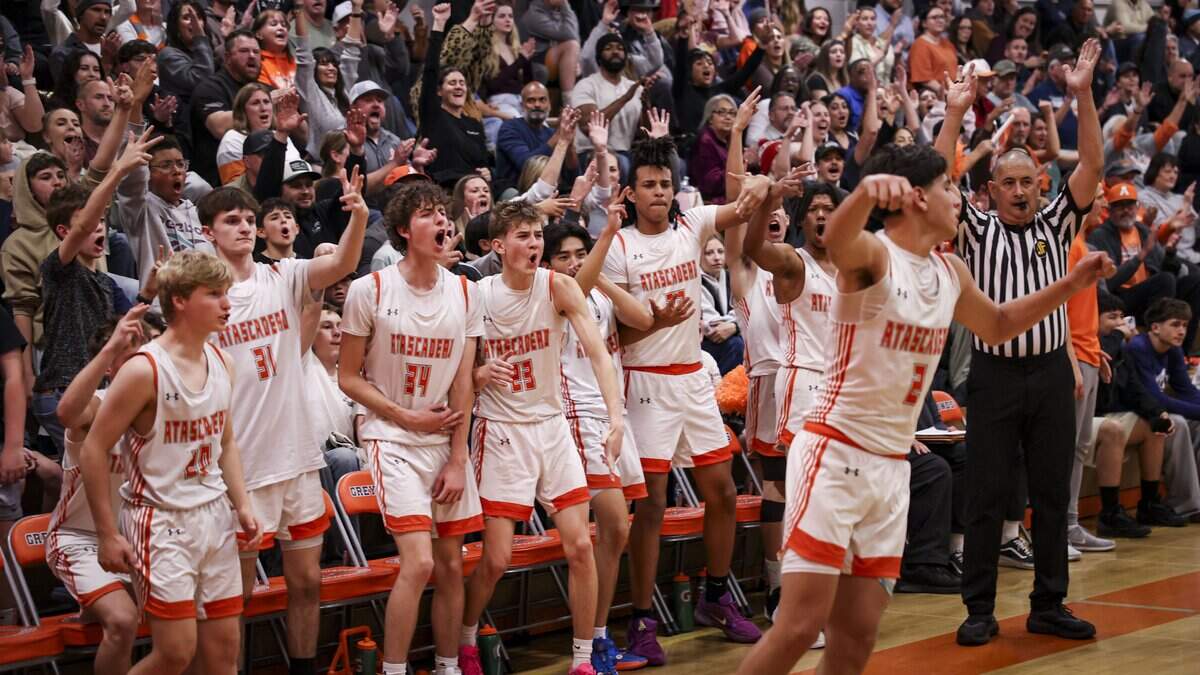 Greyhound bench celebrates a three point shot by Isaiah Rodriguez. Atascadero beat Hoover 69-52 to advance to the final game in the Division II CIF Central Section Boys Basketball Championships.