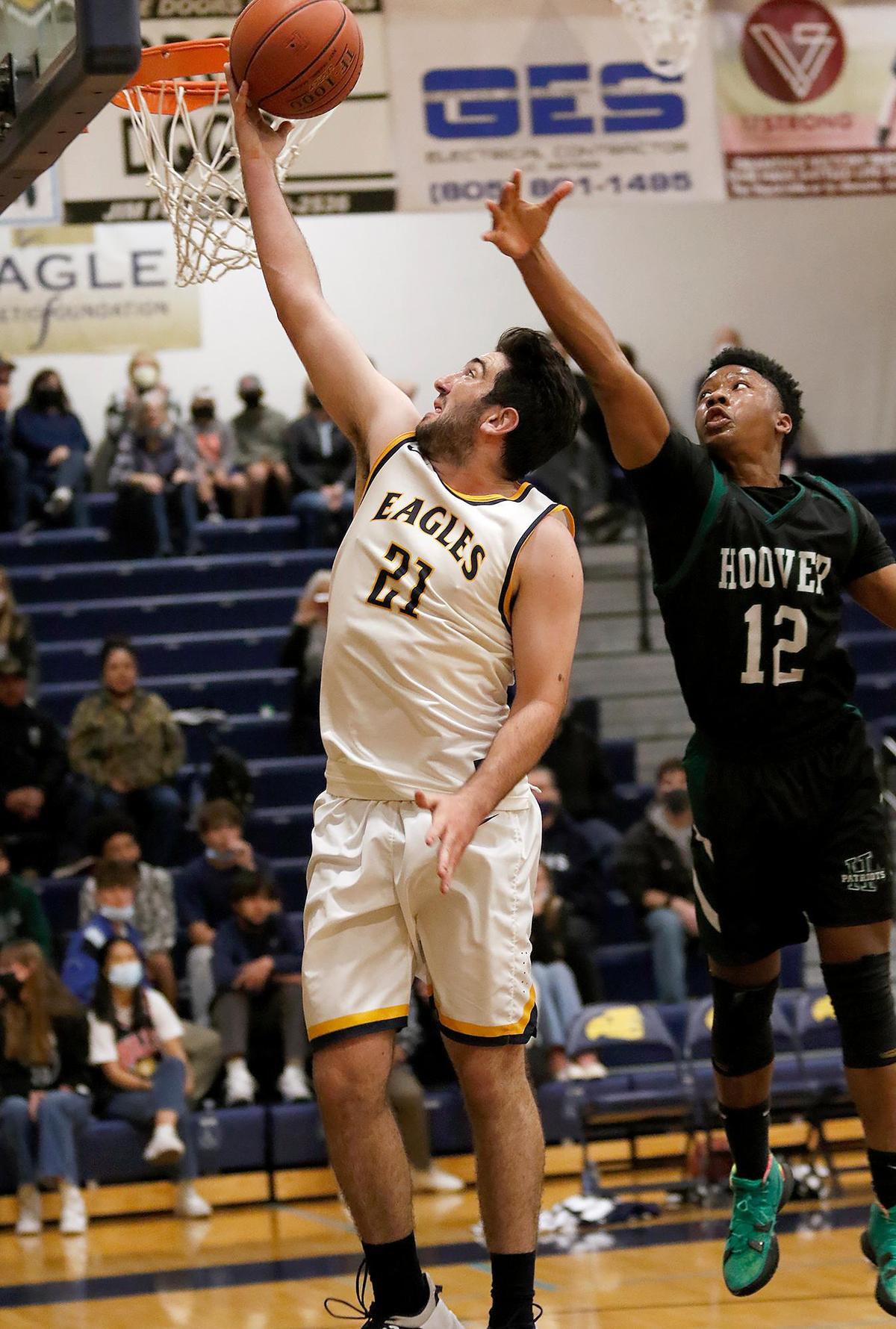 Arroyo Grande’s boys basketball team lost to Hoover of Fresno 68-63 in a first round CIF-Central playoff game. Dylan Schmidt (21) goes for the basket in the 3rd quarter.